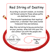A product image features a vibrant red string bracelet with shiny gold accent beads, alongside descriptive text explaining the 'Red String of Destiny' symbolism for protection and love, prominently displaying the Cherry Tree Collection logo and 'Knotted By Hand' text on a clean white background