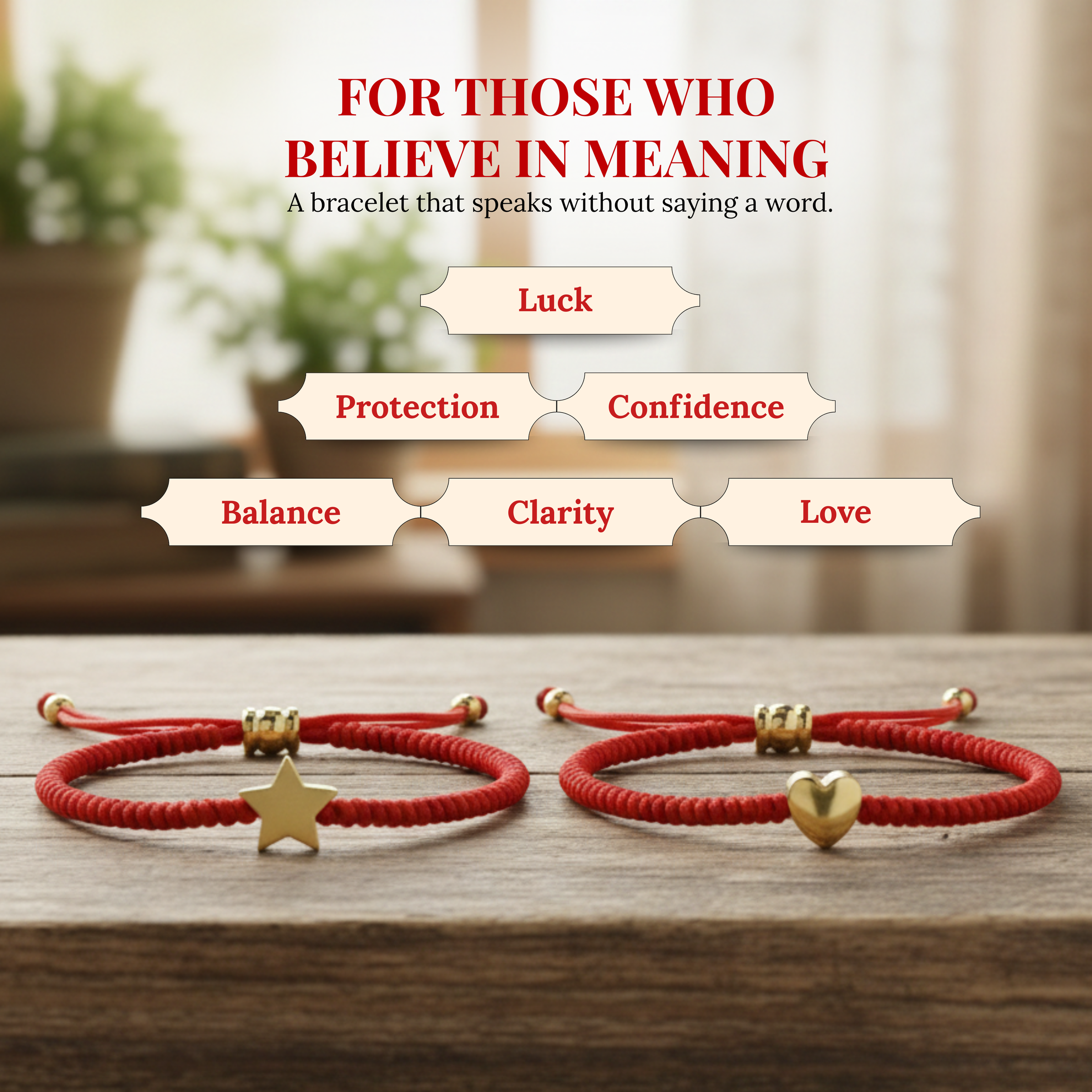 Two red string adjustable bracelets, one with a gold star charm and the other with a gold heart charm, are laid on a wooden surface beneath the headline 'FOR THOSE WHO BELIEVE IN MEANING A bracelet that speaks without saying a word' and six labels: Luck, Protection, Confidence, Balance, Clarity, Love
