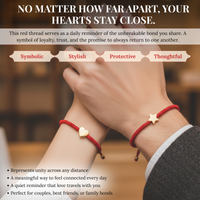 Photograph of two wrists, one wearing a red string bracelet with a gold heart charm and the other a red string bracelet with a gold star charm, symbolizing unbreakable loyalty and connection