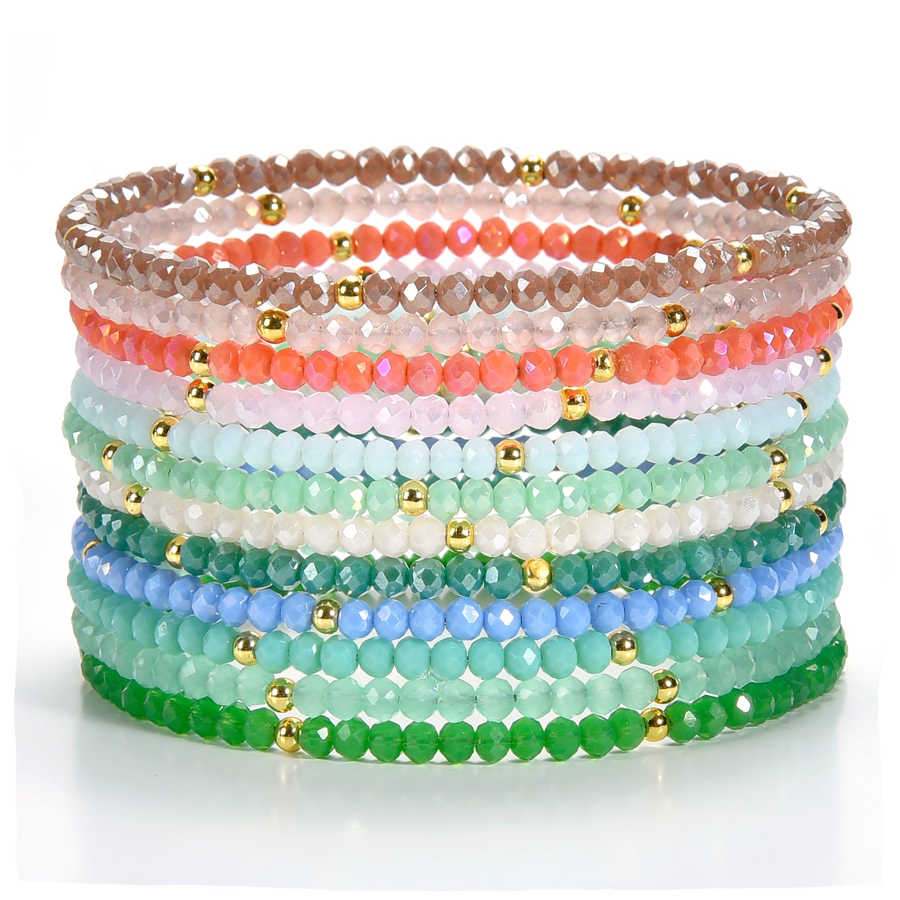 Beaded bracelets a vibrant stack of colorful faceted glass beads in a gradient from soft browns and corals to cool blues and greens, interspersed with tiny shiny gold spacer beads, on a white surface