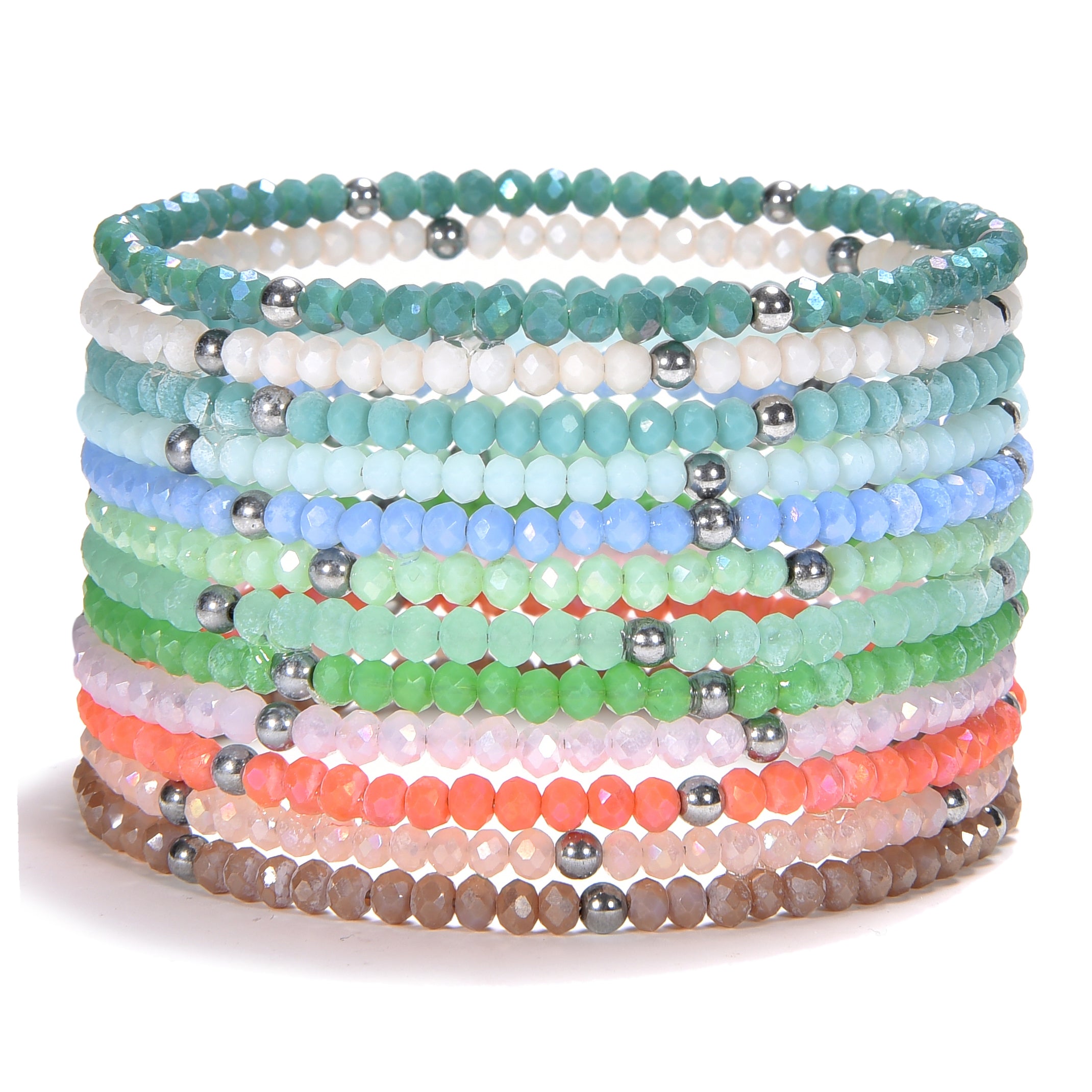 A stack of colorful beaded bracelets featuring faceted glass beads in a gradient of pastel blues, greens, peaches, pinks, and browns, interspersed with shiny silver-tone metallic spacer beads on a clean white studio background