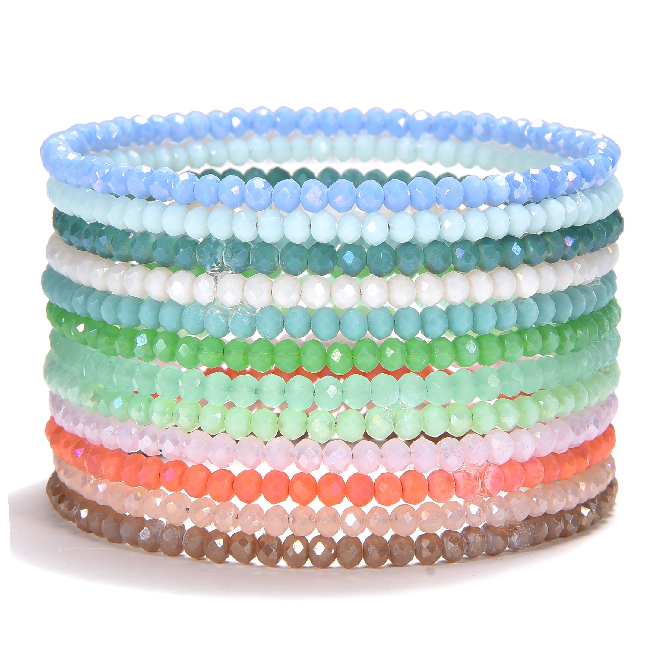 A vibrant stack of multiple beaded bracelets crafted from small faceted glass beads displaying a color gradient from cool blues and greens to warm pinks coral and brown on a white background