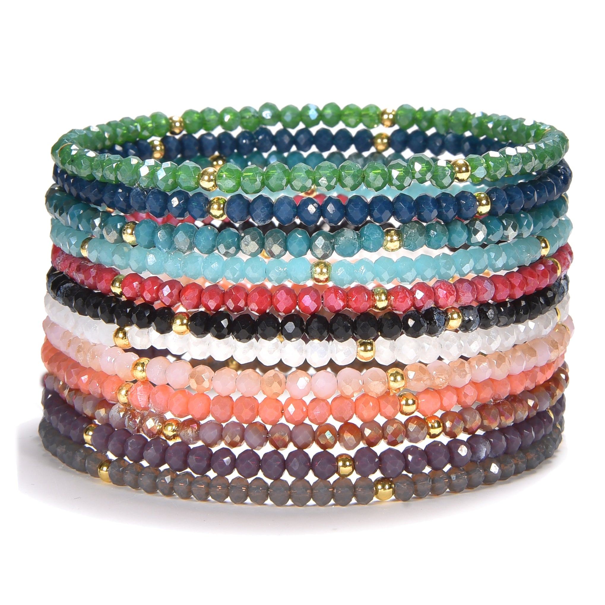 A vibrant stack of faceted crystal bead bracelets in a spectrum of colors including green blue red black white pink coral and purple accented with small gold spacer beads on a clean white background